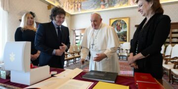 Argentine President Javier Milei, second from left, his sister and Secretary-General of the Presidency Karina Milei, left, and Foreign Minister Diana Mondino, right, exchange gifts with Pope Francis as they arrive in the pontiff's studio at The Vatican for a private audience. Photo: AP