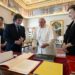 Argentine President Javier Milei, second from left, his sister and Secretary-General of the Presidency Karina Milei, left, and Foreign Minister Diana Mondino, right, exchange gifts with Pope Francis as they arrive in the pontiff's studio at The Vatican for a private audience. Photo: AP